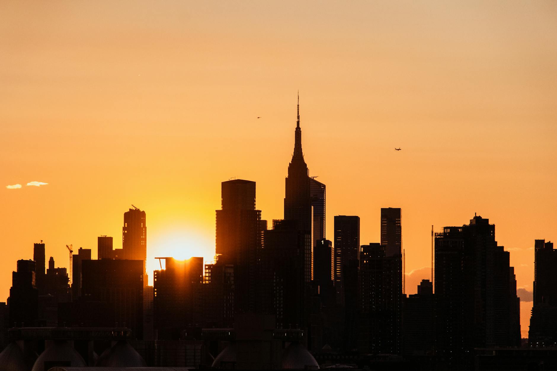 silhouette of manhattan skyscrapers at sunset